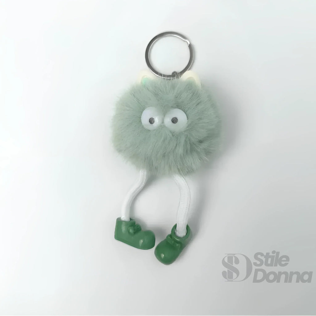 Charm Per Borsa Pom Pom Personaggio In Pelliccia Sintetica E Plastica Con Viso E Gambe Pendenti