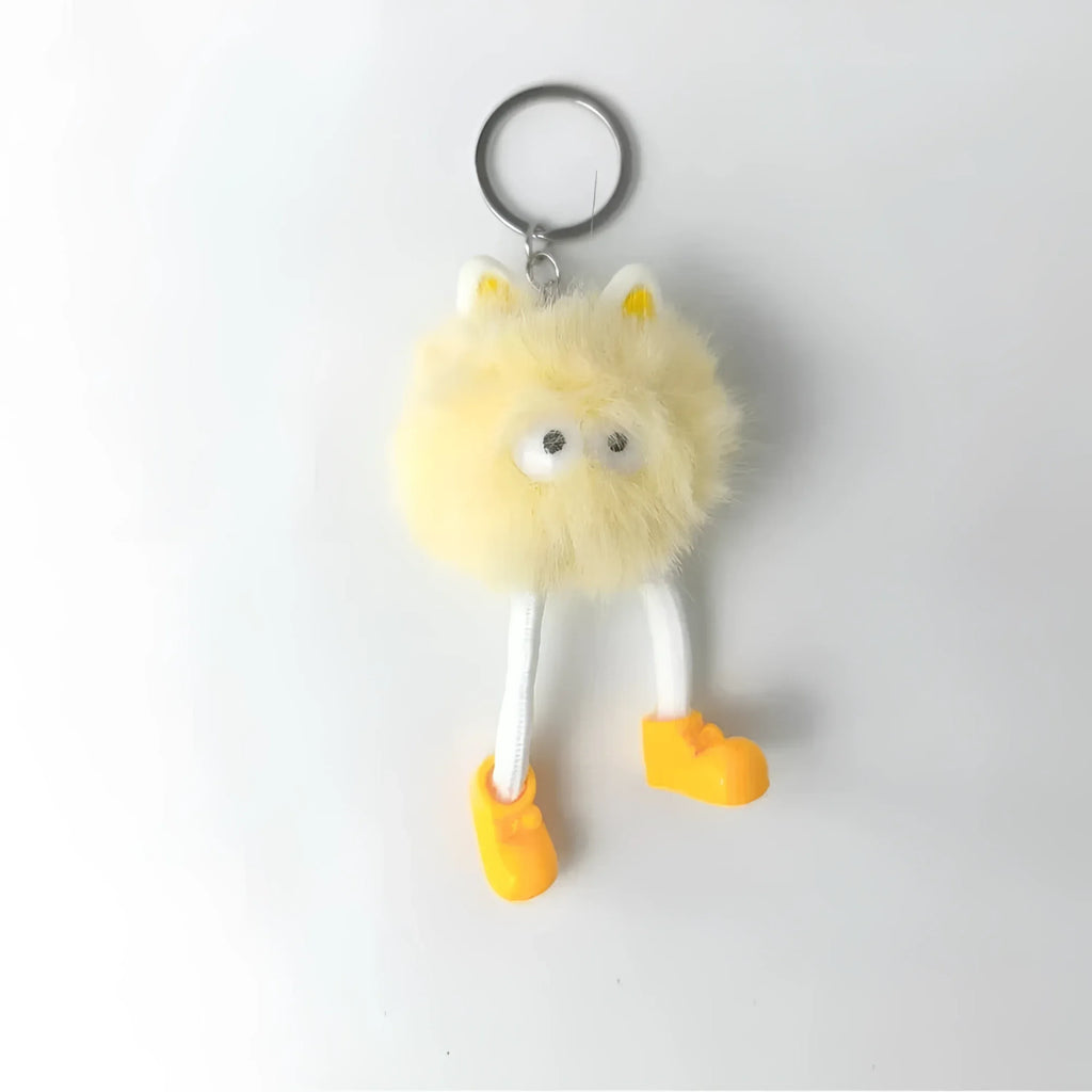 Charm Per Borsa Pom Pom Personaggio In Pelliccia Sintetica E Plastica Con Viso E Gambe Pendenti