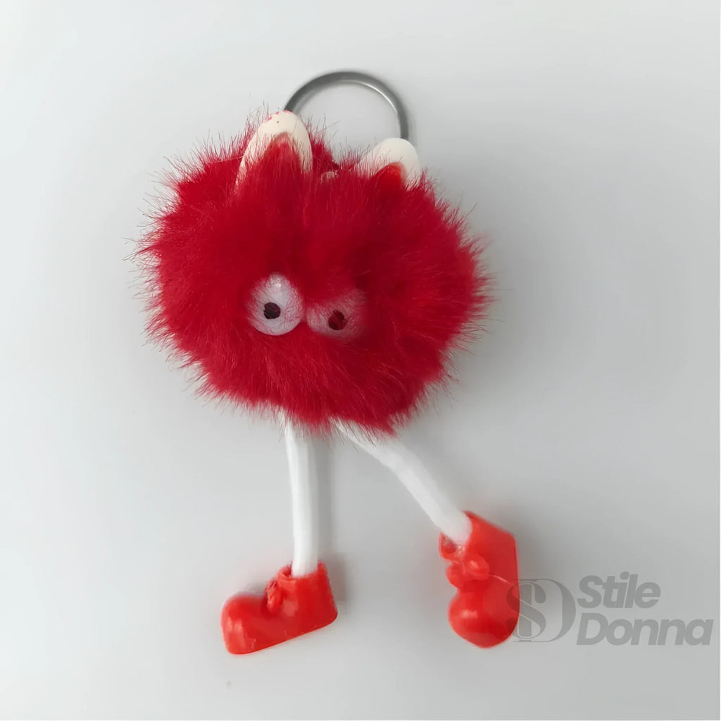 Charm Per Borsa Pom Pom Personaggio In Pelliccia Sintetica E Plastica Con Viso E Gambe Pendenti