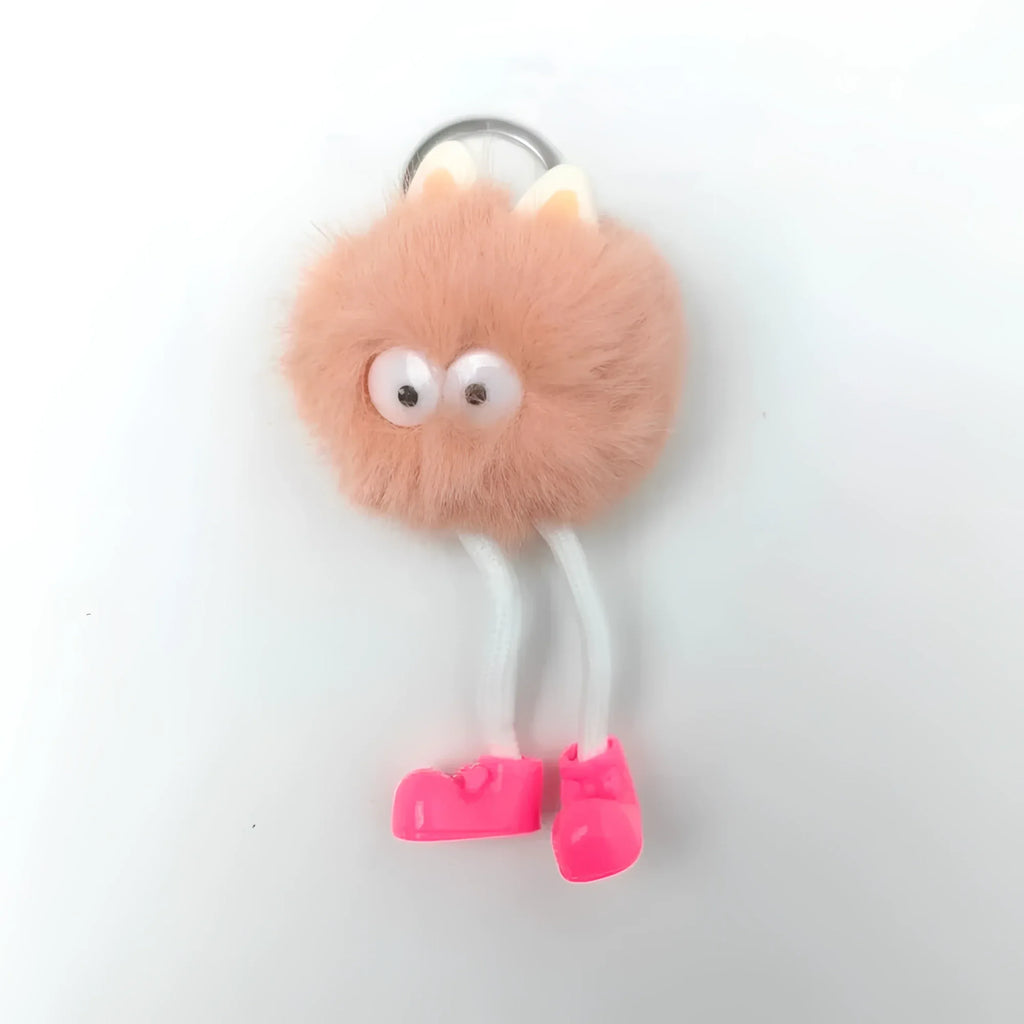 Charm Per Borsa Pom Pom Personaggio In Pelliccia Sintetica E Plastica Con Viso E Gambe Pendenti